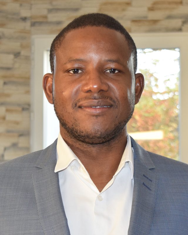 Jean SILGA, founder of Vixoris, in a grey jacket and white shirt
